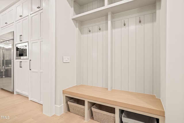 mudroom with light wood finished floors