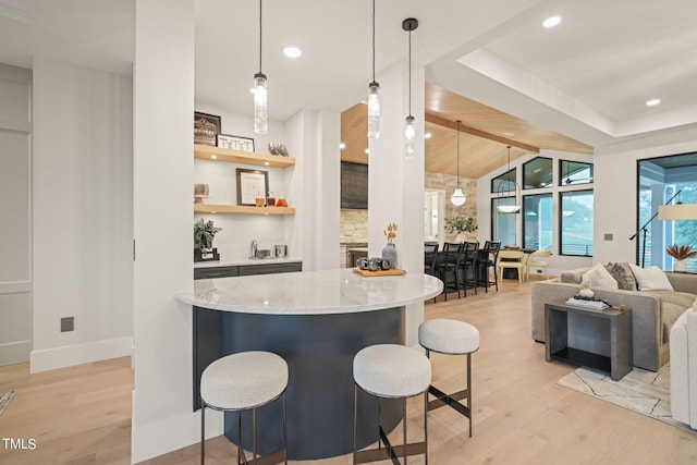 bar featuring vaulted ceiling with beams, recessed lighting, hanging light fixtures, and light wood finished floors