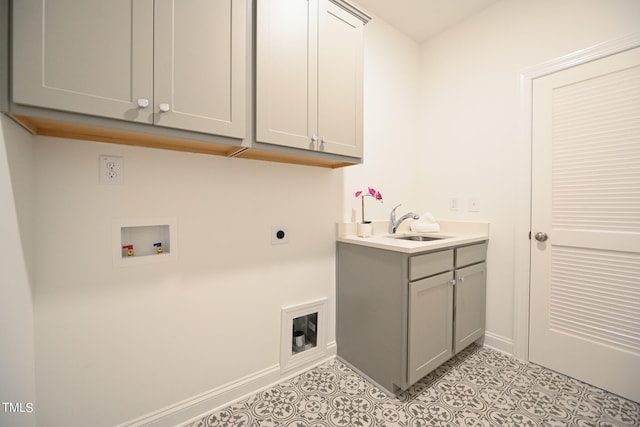 laundry area featuring hookup for a washing machine, sink, cabinets, electric dryer hookup, and light tile patterned flooring