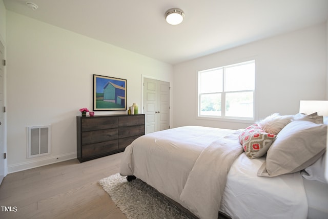 bedroom with light hardwood / wood-style floors