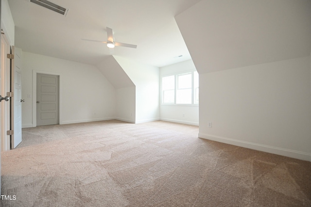 bonus room featuring ceiling fan, carpet, and vaulted ceiling