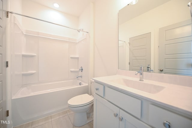 full bathroom featuring washtub / shower combination, toilet, tile patterned flooring, and vanity