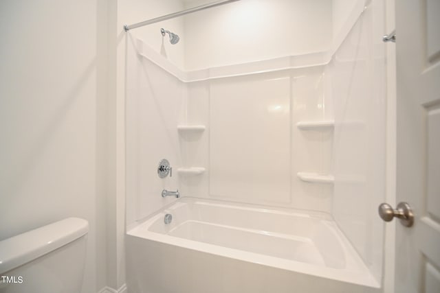 bathroom with bathtub / shower combination and toilet