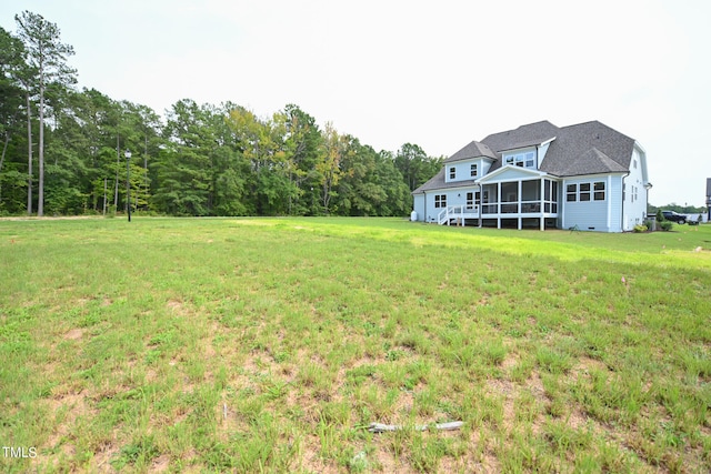 view of yard with a sunroom