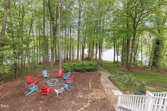 view of yard featuring an outdoor fire pit