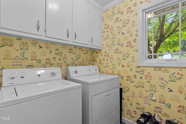 washroom with crown molding, cabinets, and separate washer and dryer