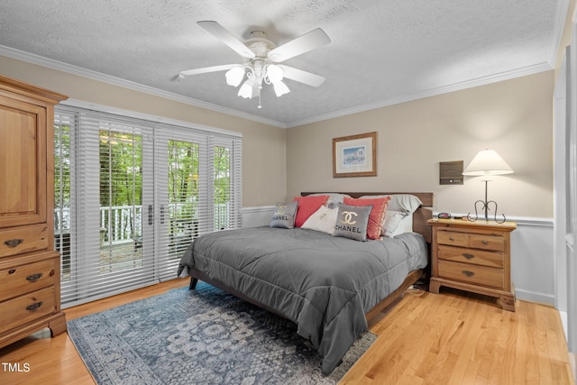 bedroom with ceiling fan, crown molding, and light wood-type flooring