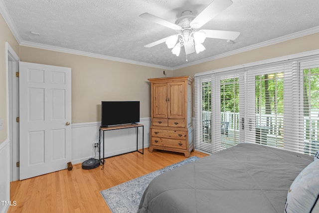 bedroom featuring ornamental molding, multiple windows, and light wood-type flooring