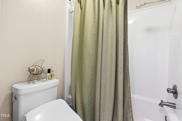 bathroom with shower / tub combo with curtain and toilet