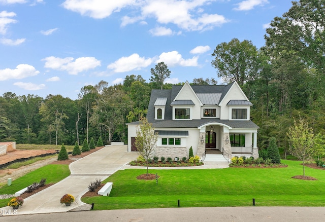 view of front facade with a front lawn and covered porch