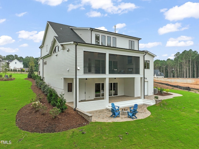 back of house featuring a patio, a lawn, ceiling fan, and a sunroom