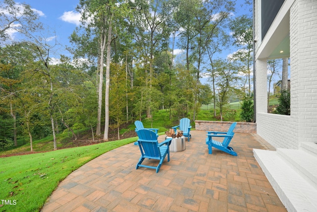 view of patio / terrace with an outdoor fire pit