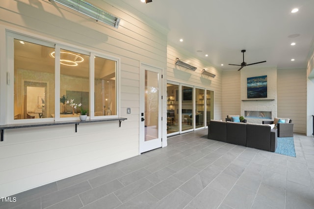 view of patio / terrace with an outdoor living space and ceiling fan