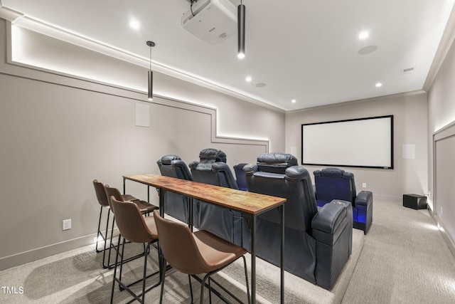 cinema featuring light colored carpet and crown molding