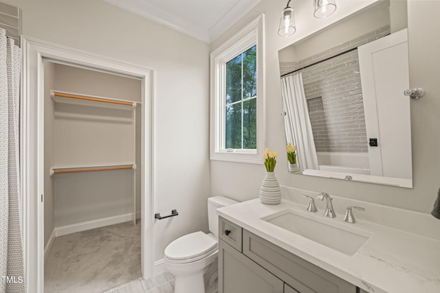 bathroom with ornamental molding, vanity, a shower with curtain, and toilet