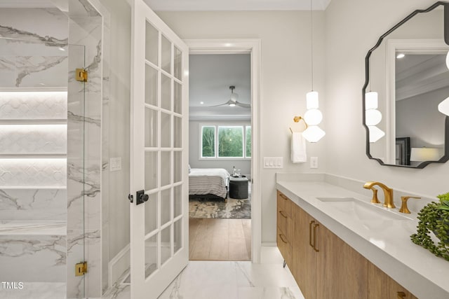 bathroom featuring crown molding, hardwood / wood-style flooring, vanity, and a shower with door