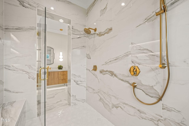 bathroom with vanity and a shower with shower door