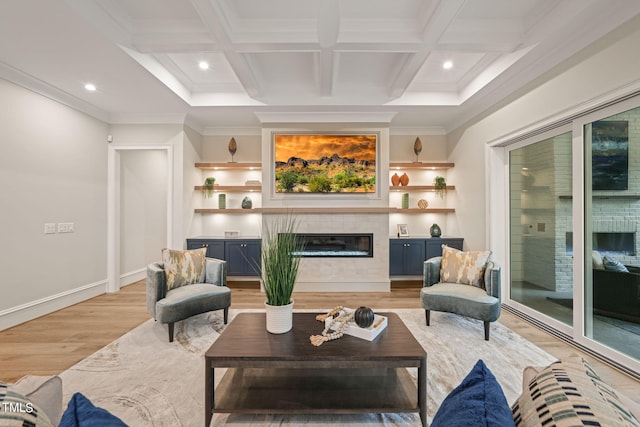 living room with ornamental molding, light wood-type flooring, beamed ceiling, and coffered ceiling