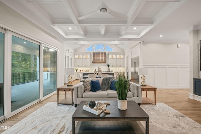 living room featuring light hardwood / wood-style flooring, beam ceiling, coffered ceiling, and ornamental molding