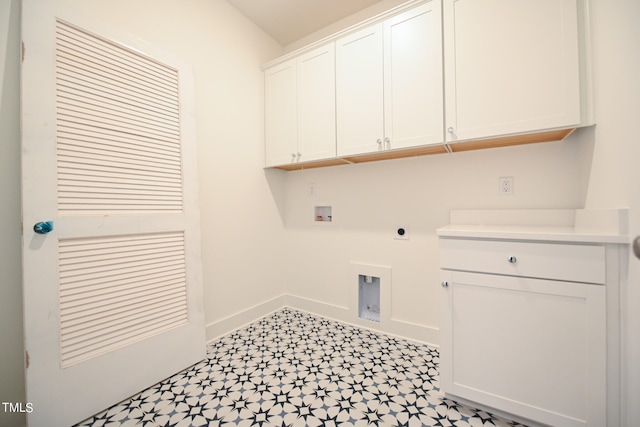 laundry room with hookup for an electric dryer, washer hookup, and cabinets