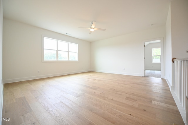 unfurnished room featuring ceiling fan and light hardwood / wood-style flooring