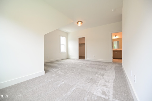 empty room featuring light carpet