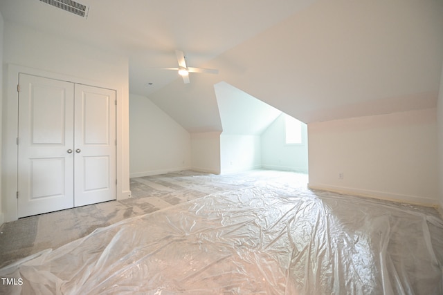 bonus room featuring light carpet, ceiling fan, and lofted ceiling