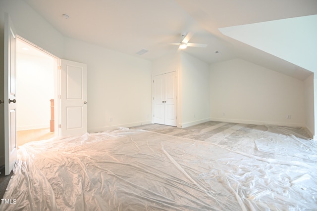 additional living space with ceiling fan and lofted ceiling