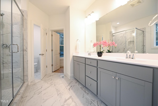 bathroom with vanity, toilet, and walk in shower