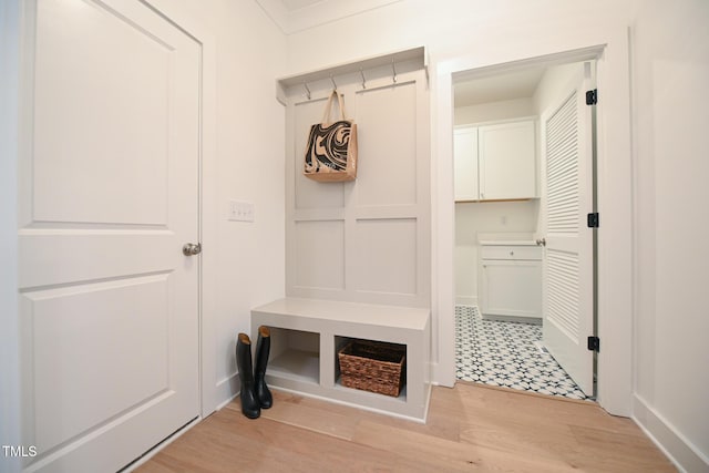 mudroom with light hardwood / wood-style flooring