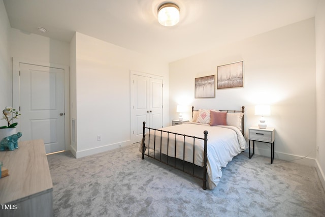 bedroom with a closet and carpet