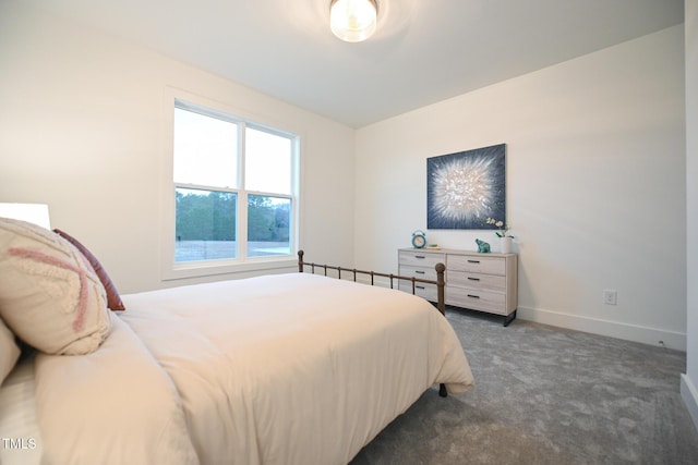 bedroom with dark carpet