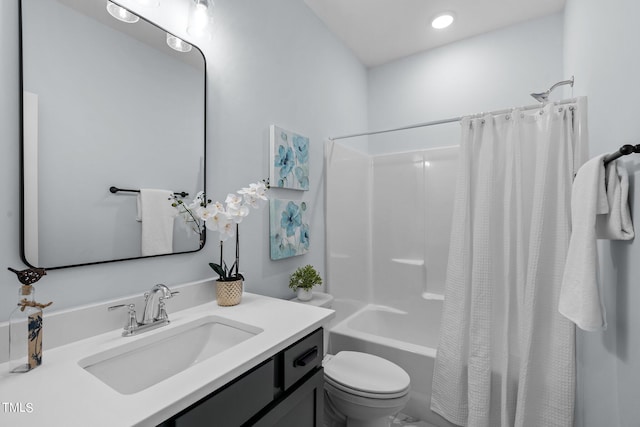 full bathroom with shower / bath combination with curtain, vanity, and toilet