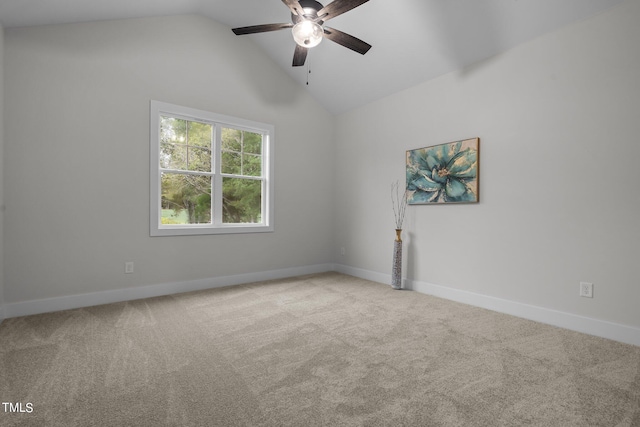 carpeted spare room featuring ceiling fan and high vaulted ceiling