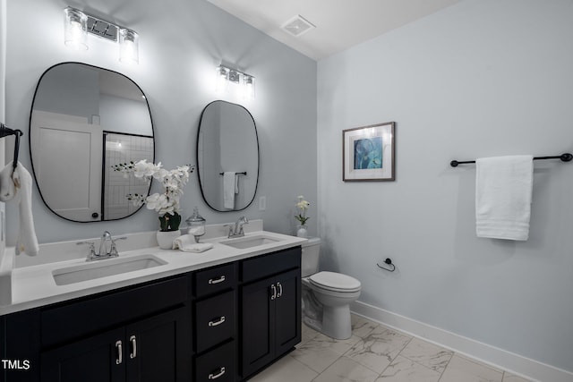 bathroom with vanity and toilet