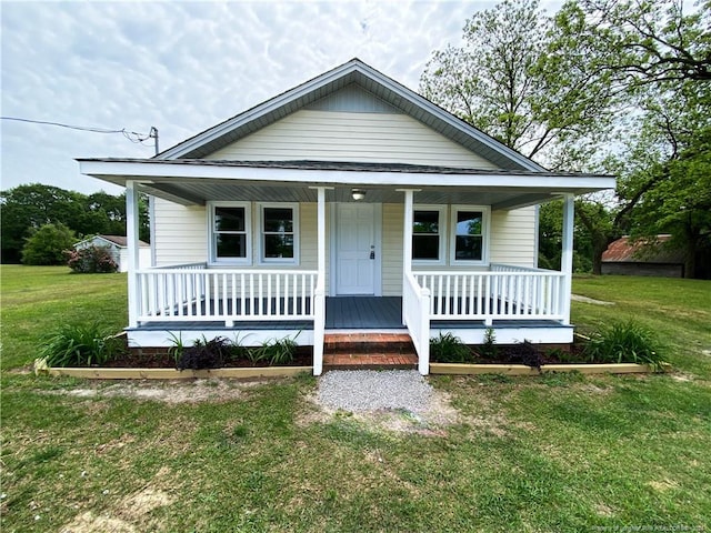 bungalow-style house featuring a porch and a front yard