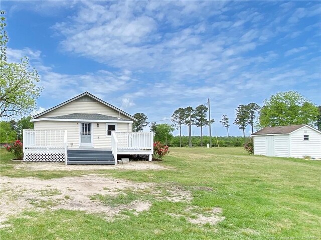 exterior space featuring a wooden deck and a storage unit