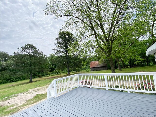 wooden terrace with a yard