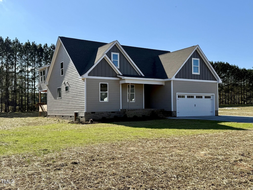 craftsman-style house with a front lawn and a garage