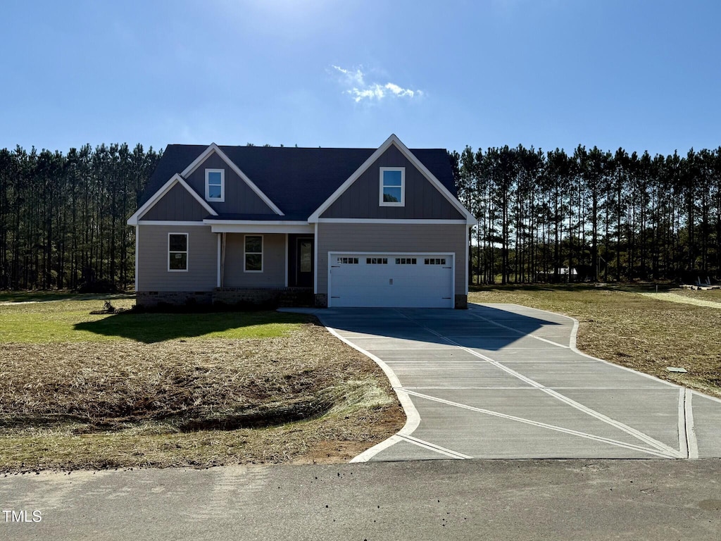 craftsman inspired home with a front lawn