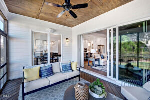 interior space with an outdoor living space and ceiling fan