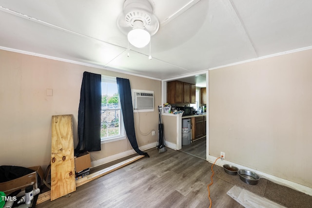 miscellaneous room with ornamental molding, ceiling fan, hardwood / wood-style flooring, and a wall mounted air conditioner