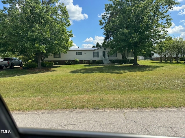 view of front of home with a front lawn