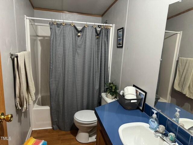 full bathroom with shower / bath combination with curtain, toilet, ornamental molding, wood-type flooring, and vanity