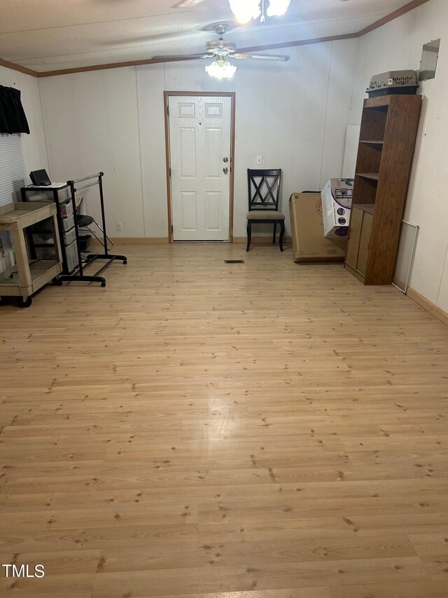 living area featuring ceiling fan and light wood-type flooring