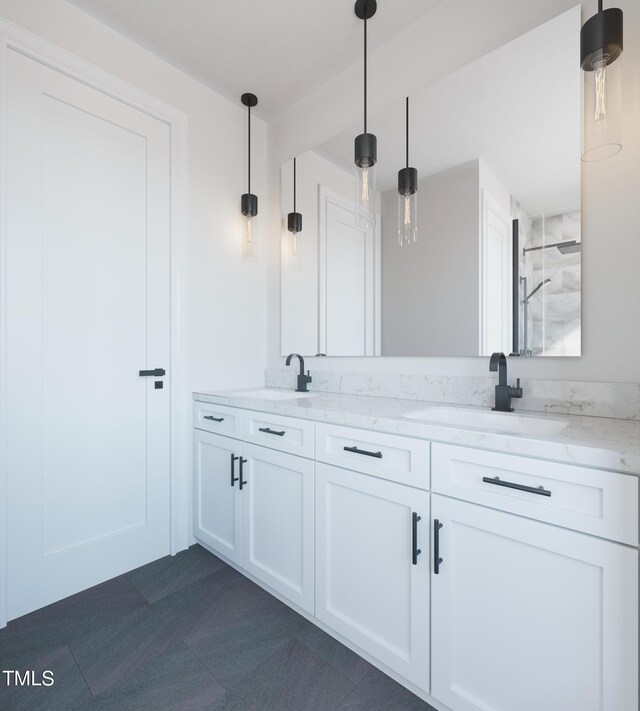 bathroom with double vanity, a shower, and a sink