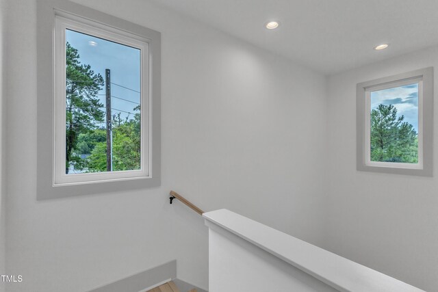 stairs featuring recessed lighting