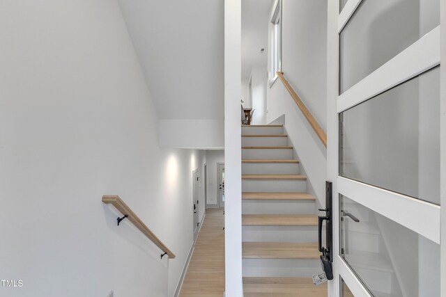 stairs with wood finished floors