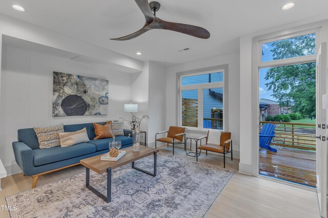 living room featuring ceiling fan, wood finished floors, and recessed lighting