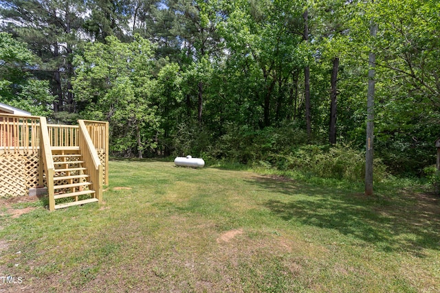 view of yard with a deck